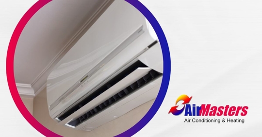 A white ductless ac mounted on a wall