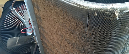 An HVAC compressor with dirty condenser coils.